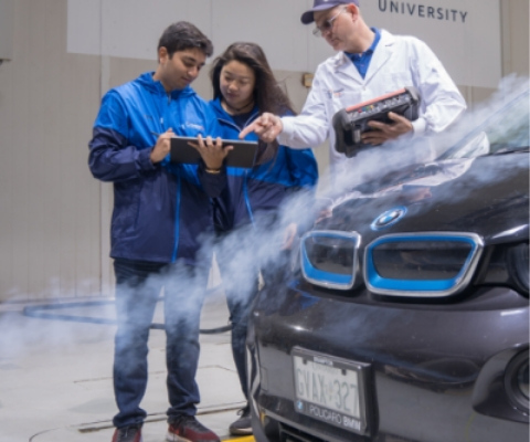 Students working on car heater 