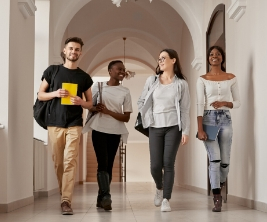 Students walking in a university gallery 