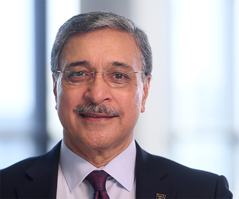 Headshot of Deep Sain, wearing suit and tie